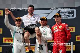 The podium (L to R): Valtteri Bottas (FIN) Mercedes AMG F1, second; Nathan Divey (GBR) Mercedes AMG F1 No1 Mechanic; Lewis Hamilton (GBR) Mercedes AMG F1, race winner; Charles Leclerc (MON) Ferrari, third. 23.06.2019. Formula 1 World Championship, Rd 8, French Grand Prix, Paul Ricard, France, Race Day.