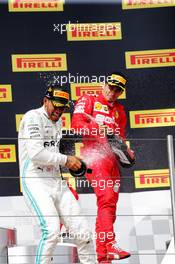 Race winner Lewis Hamilton (GBR) Mercedes AMG F1 celebrates on the podium with Charles Leclerc (MON) Ferrari. 23.06.2019. Formula 1 World Championship, Rd 8, French Grand Prix, Paul Ricard, France, Race Day.