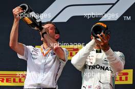 (L to R): Nathan Divey (GBR) Mercedes AMG F1 No1 Mechanic celebrates on the podium with race winner Lewis Hamilton (GBR) Mercedes AMG F1. 23.06.2019. Formula 1 World Championship, Rd 8, French Grand Prix, Paul Ricard, France, Race Day.