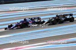 Alexander Albon (THA) Scuderia Toro Rosso STR14 and Kevin Magnussen (DEN) Haas VF-19 battle for position. 23.06.2019. Formula 1 World Championship, Rd 8, French Grand Prix, Paul Ricard, France, Race Day.