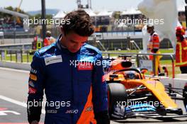 Lando Norris (GBR) McLaren passed by team mate Carlos Sainz Jr (ESP) McLaren MCL34.