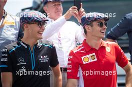 (L to R): George Russell (GBR) Williams Racing and Charles Leclerc (MON) Ferrari celebrate the 80th birthday of Jackie Stewart (GBR). 23.06.2019. Formula 1 World Championship, Rd 8, French Grand Prix, Paul Ricard, France, Race Day.
