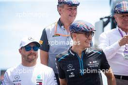(L to R): Valtteri Bottas (FIN) Mercedes AMG F1 and George Russell (GBR) Williams Racing celebrate the 80th birthday of Jackie Stewart (GBR). 23.06.2019. Formula 1 World Championship, Rd 8, French Grand Prix, Paul Ricard, France, Race Day.