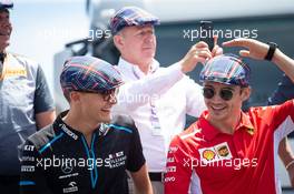 (L to R): George Russell (GBR) Williams Racing and Charles Leclerc (MON) Ferrari celebrate the 80th birthday of Jackie Stewart (GBR). 23.06.2019. Formula 1 World Championship, Rd 8, French Grand Prix, Paul Ricard, France, Race Day.