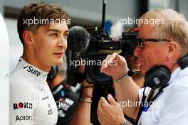 George Russell (GBR) Williams Racing with Jo Bauer (GER) FIA Delegate. 12.07.2019. Formula 1 World Championship, Rd 10, British Grand Prix, Silverstone, England, Practice Day.