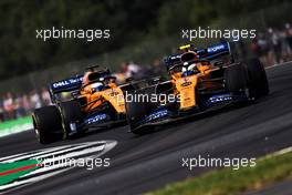 Lando Norris (GBR) McLaren MCL34 leads team mate Carlos Sainz Jr (ESP) McLaren MCL34. 12.07.2019. Formula 1 World Championship, Rd 10, British Grand Prix, Silverstone, England, Practice Day.