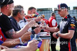 Max Verstappen (NLD) Red Bull Racing signs autographs for the fans. 12.07.2019. Formula 1 World Championship, Rd 10, British Grand Prix, Silverstone, England, Practice Day.