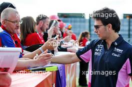 Sergio Perez (MEX) Racing Point F1 Team signs autographs for the fans. 12.07.2019. Formula 1 World Championship, Rd 10, British Grand Prix, Silverstone, England, Practice Day.