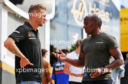 (L to R): Kevin Magnussen (DEN) Haas F1 Team with Anthony Hamilton (GBR). 12.07.2019. Formula 1 World Championship, Rd 10, British Grand Prix, Silverstone, England, Practice Day.
