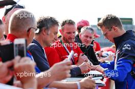 Daniil Kvyat (RUS) Scuderia Toro Rosso signs autographs for the fans. 12.07.2019. Formula 1 World Championship, Rd 10, British Grand Prix, Silverstone, England, Practice Day.