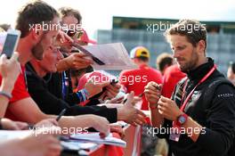 Romain Grosjean (FRA) Haas F1 Team signs autographs for the fans. 12.07.2019. Formula 1 World Championship, Rd 10, British Grand Prix, Silverstone, England, Practice Day.