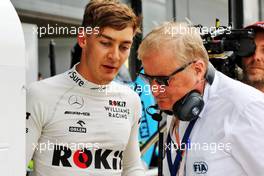 George Russell (GBR) Williams Racing with Jo Bauer (GER) FIA Delegate. 12.07.2019. Formula 1 World Championship, Rd 10, British Grand Prix, Silverstone, England, Practice Day.