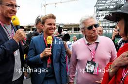 Nico Rosberg (GER) with Michael Douglas (USA) Actor and Catherine Zeta-Jones (GBR) Actress on the grid. 14.07.2019. Formula 1 World Championship, Rd 10, British Grand Prix, Silverstone, England, Race Day.