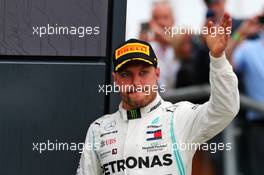 Valtteri Bottas (FIN) Mercedes AMG F1 celebrates his second position on the podium. 14.07.2019. Formula 1 World Championship, Rd 10, British Grand Prix, Silverstone, England, Race Day.