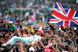 1st place Lewis Hamilton (GBR) Mercedes AMG F1 W10 crowd surfing. 14.07.2019. Formula 1 World Championship, Rd 10, British Grand Prix, Silverstone, England, Race Day.