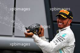 Race winner Lewis Hamilton (GBR) Mercedes AMG F1 celebrates on the podium. 14.07.2019. Formula 1 World Championship, Rd 10, British Grand Prix, Silverstone, England, Race Day.