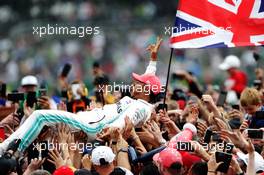 Race winner Lewis Hamilton (GBR) Mercedes AMG F1 celebrates with fans after the podium. 14.07.2019. Formula 1 World Championship, Rd 10, British Grand Prix, Silverstone, England, Race Day.
