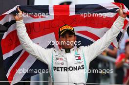 Race winner Lewis Hamilton (GBR) Mercedes AMG F1 celebrates on the podium. 14.07.2019. Formula 1 World Championship, Rd 10, British Grand Prix, Silverstone, England, Race Day.