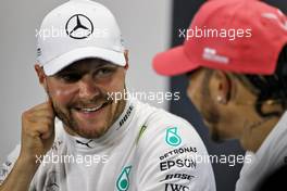 Valtteri Bottas (FIN) Mercedes AMG F1 and team mate Lewis Hamilton (GBR) Mercedes AMG F1 in the post race FIA Press Conference. 14.07.2019. Formula 1 World Championship, Rd 10, British Grand Prix, Silverstone, England, Race Day.