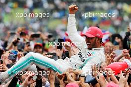 Race winner Lewis Hamilton (GBR) Mercedes AMG F1 celebrates with fans after the podium. 14.07.2019. Formula 1 World Championship, Rd 10, British Grand Prix, Silverstone, England, Race Day.