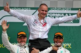 Race winner Lewis Hamilton (GBR) Mercedes AMG F1 celebrates with Valtteri Bottas (FIN) Mercedes AMG F1 on the podium. 14.07.2019. Formula 1 World Championship, Rd 10, British Grand Prix, Silverstone, England, Race Day.