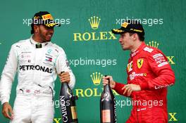 Race winner Lewis Hamilton (GBR) Mercedes AMG F1 celebrates on the podium with Charles Leclerc (MON) Ferrari. 14.07.2019. Formula 1 World Championship, Rd 10, British Grand Prix, Silverstone, England, Race Day.