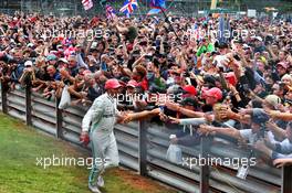 Race winner Lewis Hamilton (GBR) Mercedes AMG F1 celebrates with the fans at the podium. 14.07.2019. Formula 1 World Championship, Rd 10, British Grand Prix, Silverstone, England, Race Day.