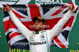 Race winner Lewis Hamilton (GBR) Mercedes AMG F1 celebrates on the podium. 14.07.2019. Formula 1 World Championship, Rd 10, British Grand Prix, Silverstone, England, Race Day.