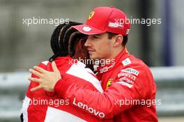 (L to R): race winner Lewis Hamilton (GBR) Mercedes AMG F1 celebrates with Charles Leclerc (MON) Ferrari in parc ferme. 14.07.2019. Formula 1 World Championship, Rd 10, British Grand Prix, Silverstone, England, Race Day.