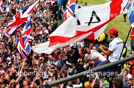 Race winner Lewis Hamilton (GBR) Mercedes AMG F1 celebrates with the fans at the end of the race. 14.07.2019. Formula 1 World Championship, Rd 10, British Grand Prix, Silverstone, England, Race Day.