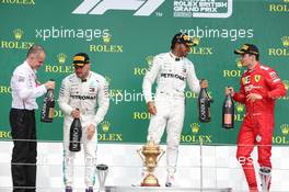 1st place Lewis Hamilton (GBR) Mercedes AMG F1 W10 with Valtteri Bottas (FIN) Mercedes AMG F1 W10 and Charles Leclerc (MON) Ferrari SF90. 14.07.2019. Formula 1 World Championship, Rd 10, British Grand Prix, Silverstone, England, Race Day.