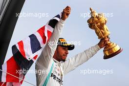 Race winner Lewis Hamilton (GBR) Mercedes AMG F1 celebrates on the podium. 14.07.2019. Formula 1 World Championship, Rd 10, British Grand Prix, Silverstone, England, Race Day.