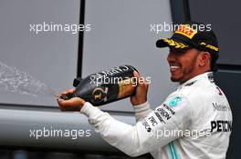 Race winner Lewis Hamilton (GBR) Mercedes AMG F1 celebrates on the podium. 14.07.2019. Formula 1 World Championship, Rd 10, British Grand Prix, Silverstone, England, Race Day.