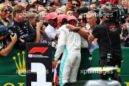 Race winner Lewis Hamilton (GBR) Mercedes AMG F1 celebrates with father Anthony Hamilton (GBR) and brother Nicolas Hamilton (GBR) in parc ferme. 14.07.2019. Formula 1 World Championship, Rd 10, British Grand Prix, Silverstone, England, Race Day.