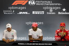 The post race FIA Press Conference (L to R): Valtteri Bottas (FIN) Mercedes AMG F1, second; Lewis Hamilton (GBR) Mercedes AMG F1, race winner; Charles Leclerc (MON) Ferrari, third. 14.07.2019. Formula 1 World Championship, Rd 10, British Grand Prix, Silverstone, England, Race Day.