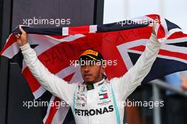 Race winner Lewis Hamilton (GBR) Mercedes AMG F1 celebrates on the podium. 14.07.2019. Formula 1 World Championship, Rd 10, British Grand Prix, Silverstone, England, Race Day.