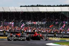 Max Verstappen (NLD) Red Bull Racing RB15 and Charles Leclerc (MON) Ferrari SF90 battle for position. 14.07.2019. Formula 1 World Championship, Rd 10, British Grand Prix, Silverstone, England, Race Day.