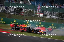 Sebastian Vettel (GER) Ferrari SF90 crashes into the back of Max Verstappen (NLD) Red Bull Racing RB15. 14.07.2019. Formula 1 World Championship, Rd 10, British Grand Prix, Silverstone, England, Race Day.