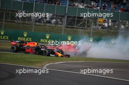 Sebastian Vettel (GER) Ferrari SF90 crashes into the back of Max Verstappen (NLD) Red Bull Racing RB15. 14.07.2019. Formula 1 World Championship, Rd 10, British Grand Prix, Silverstone, England, Race Day.
