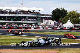Valtteri Bottas (FIN) Mercedes AMG F1 W10 and Lewis Hamilton (GBR) Mercedes AMG F1 W10 battle for the lead of the race. 14.07.2019. Formula 1 World Championship, Rd 10, British Grand Prix, Silverstone, England, Race Day.