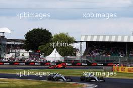 Valtteri Bottas (FIN) Mercedes AMG F1 W10 and Lewis Hamilton (GBR) Mercedes AMG F1 W10 battle for the lead of the race. 14.07.2019. Formula 1 World Championship, Rd 10, British Grand Prix, Silverstone, England, Race Day.