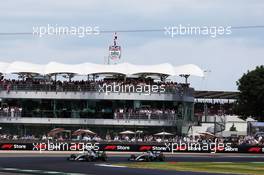 Valtteri Bottas (FIN) Mercedes AMG F1 W10 and Lewis Hamilton (GBR) Mercedes AMG F1 W10 battle for the lead of the race. 14.07.2019. Formula 1 World Championship, Rd 10, British Grand Prix, Silverstone, England, Race Day.