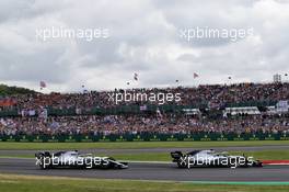 Valtteri Bottas (FIN) Mercedes AMG F1 W10 leads Lewis Hamilton (GBR) Mercedes AMG F1 W10. 14.07.2019. Formula 1 World Championship, Rd 10, British Grand Prix, Silverstone, England, Race Day.