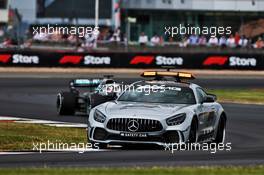 Lewis Hamilton (GBR) Mercedes AMG F1 W10 leads behind the FIA Safety Car. 14.07.2019. Formula 1 World Championship, Rd 10, British Grand Prix, Silverstone, England, Race Day.