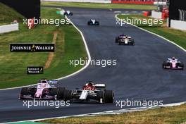Kimi Raikkonen (FIN) Alfa Romeo Racing C38 and Sergio Perez (MEX) Racing Point F1 Team RP19 battle for position. 14.07.2019. Formula 1 World Championship, Rd 10, British Grand Prix, Silverstone, England, Race Day.