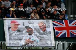 Lewis Hamilton (GBR) Mercedes AMG F1 banner with fans in the grandstand. 13.07.2019. Formula 1 World Championship, Rd 10, British Grand Prix, Silverstone, England, Qualifying Day.