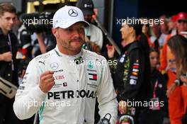 Valtteri Bottas (FIN) Mercedes AMG F1 celebrates his pole position in qualifying parc ferme. 13.07.2019. Formula 1 World Championship, Rd 10, British Grand Prix, Silverstone, England, Qualifying Day.