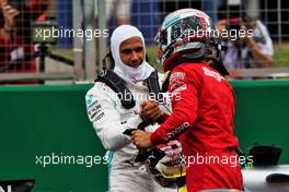 (L to R): Lewis Hamilton (GBR) Mercedes AMG F1 with Charles Leclerc (MON) Ferrari in qualifying parc ferme. 13.07.2019. Formula 1 World Championship, Rd 10, British Grand Prix, Silverstone, England, Qualifying Day.