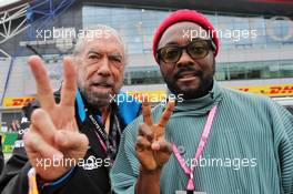 John Paul DeJoria (USA) ROK Group Co-Founder - Williams Racing guest with will.i.am (USA) Black Eyed Peas. 13.07.2019. Formula 1 World Championship, Rd 10, British Grand Prix, Silverstone, England, Qualifying Day.