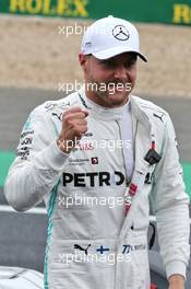 Valtteri Bottas (FIN) Mercedes AMG F1 celebrates his pole position in qualifying parc ferme. 13.07.2019. Formula 1 World Championship, Rd 10, British Grand Prix, Silverstone, England, Qualifying Day.